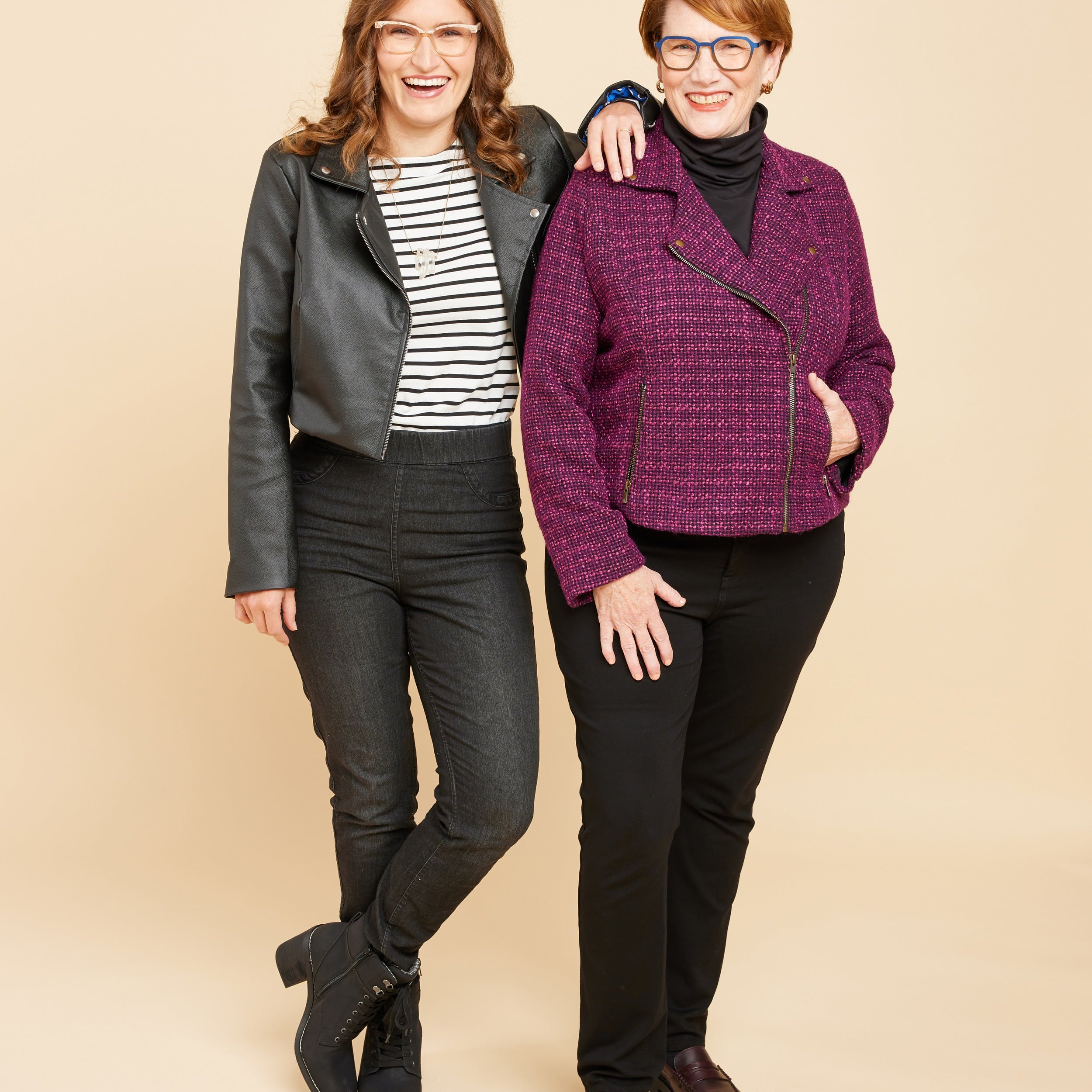 Two women wearing jackets against a beige background. This biker jacket is the Canton Moto Jacket sewing pattern from Cashmerette.