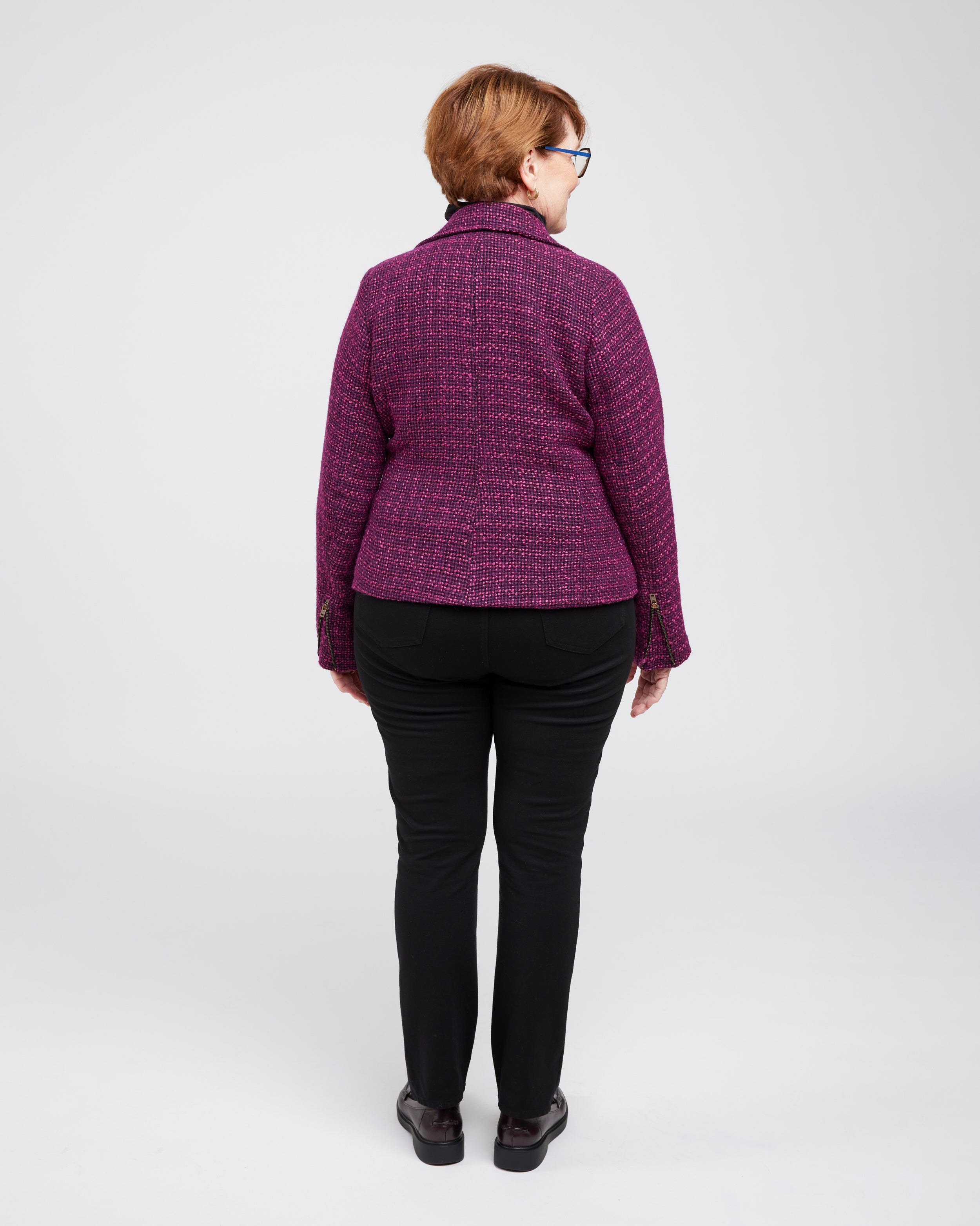 Person wearing a purple quilted jacket on a white background. This biker jacket is the Canton Moto Jacket sewing pattern from Cashmerette.