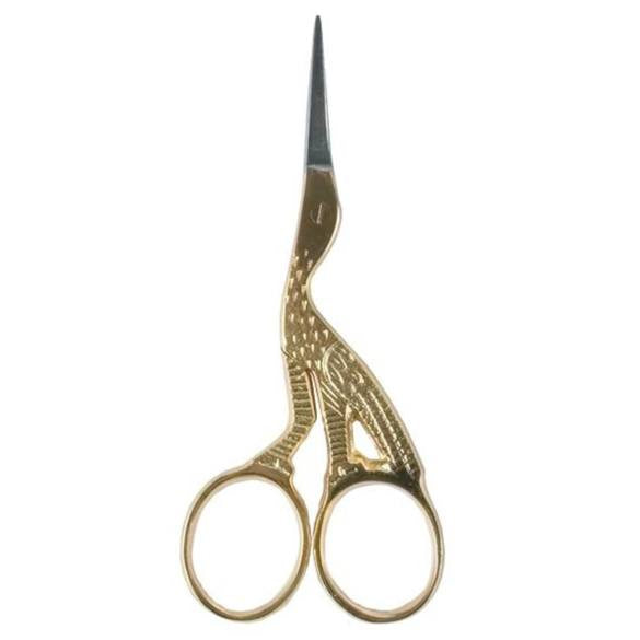 Stork embroidery scissor with gold coloured handle.