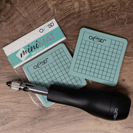 Two mini mats with hole punch.