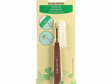Seam ripper with brown handle and cap.