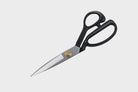 Carbon steel fabric shears with rubber handle.