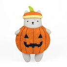 A plush toy cat dressed as a jack-o'-lantern pumpkin, featuring a gray body, an orange pumpkin-shaped outfit with a black stitched face, and an orange and yellow knit pumpkin hat with a green stem, set against a plain white background.
