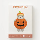A felt doll kit box for a 'Pumpkin Cat' by kiriki (felt), featuring a white box with an illustration of a gray cat dressed in an orange pumpkin costume with a green stem hat, set against a clean white background.