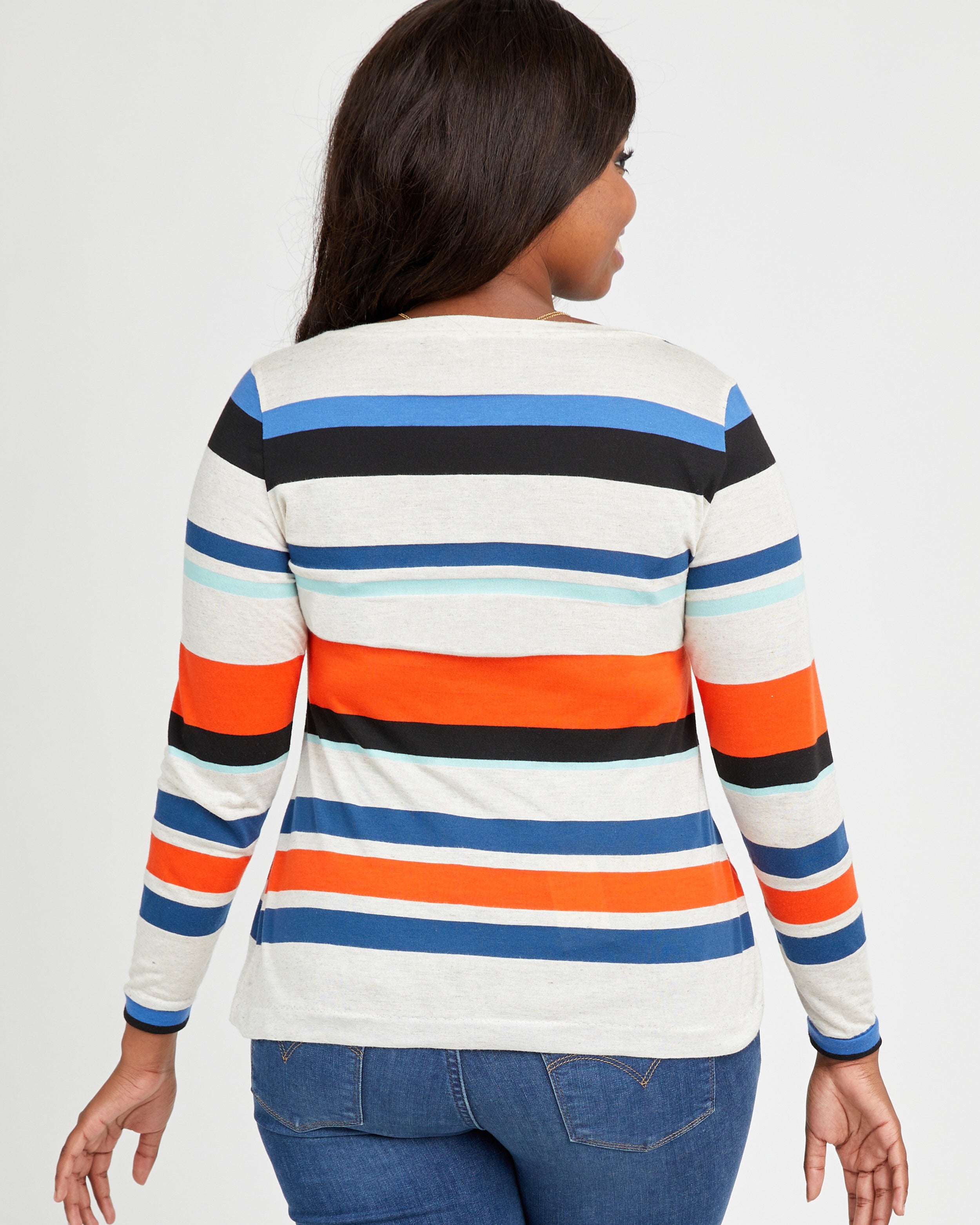 Woman wearing a striped long-sleeve shirt with a white background. This t-shirt is the Concord T-Shirt sewing pattern from Cashmerette.