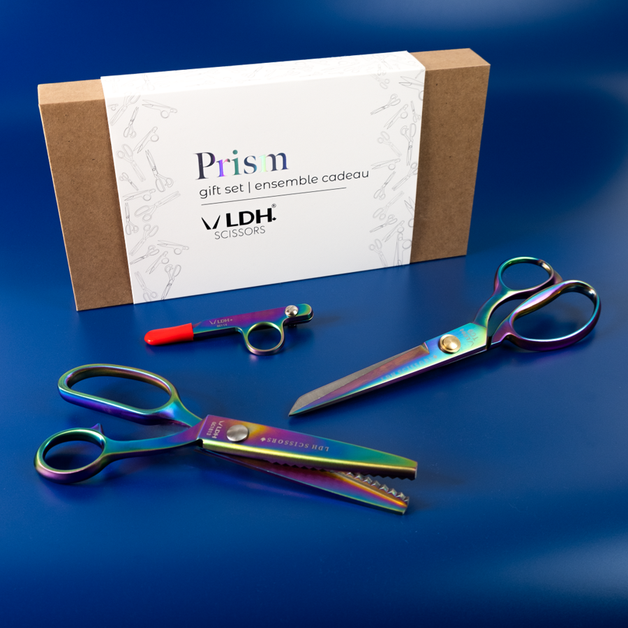 Iridescent coloured Prism Fabric Shear 9”, Prism Pinking Shear, and Prism Thread Snip.
